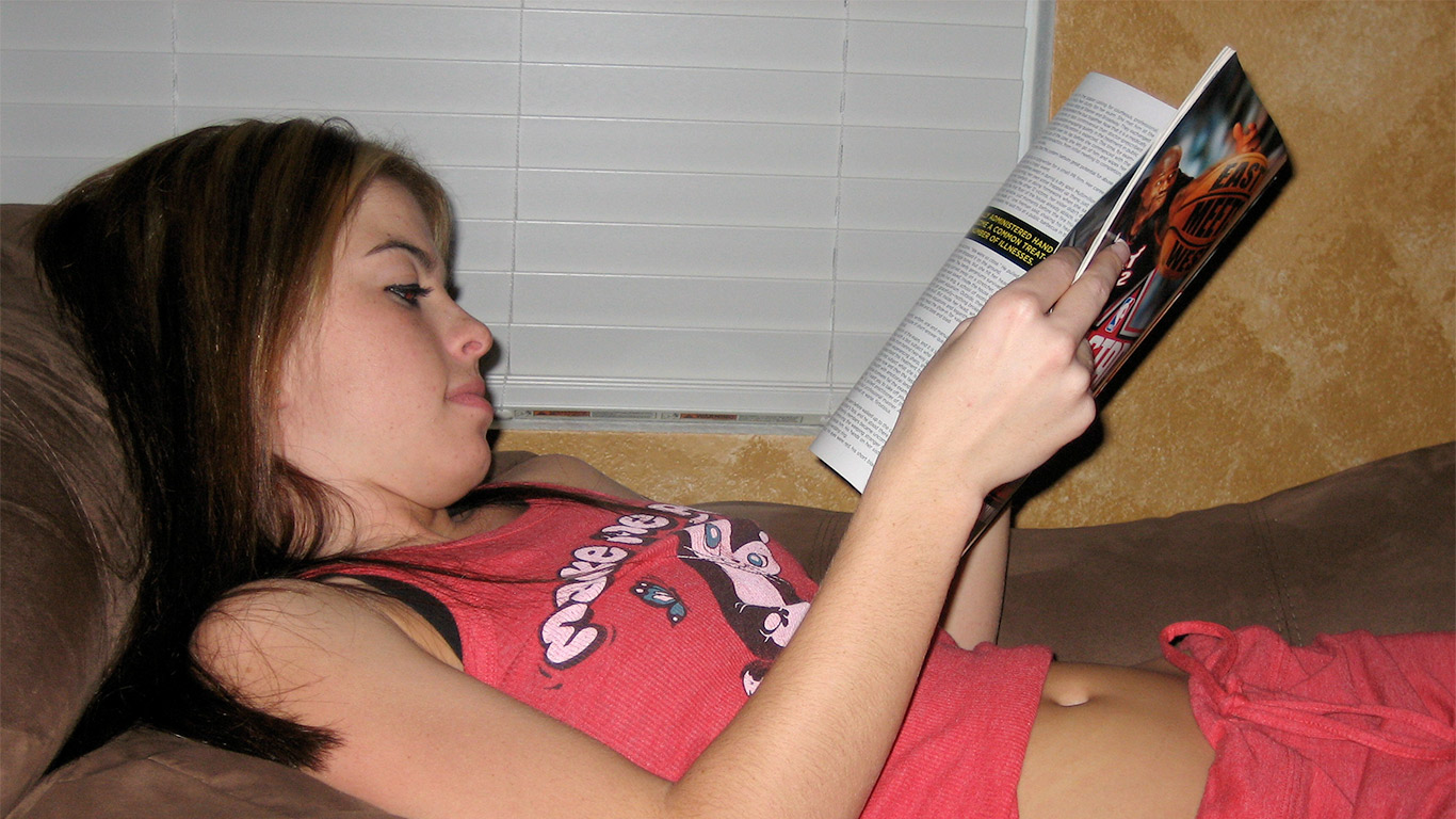 Kari reading a Playboy magazine